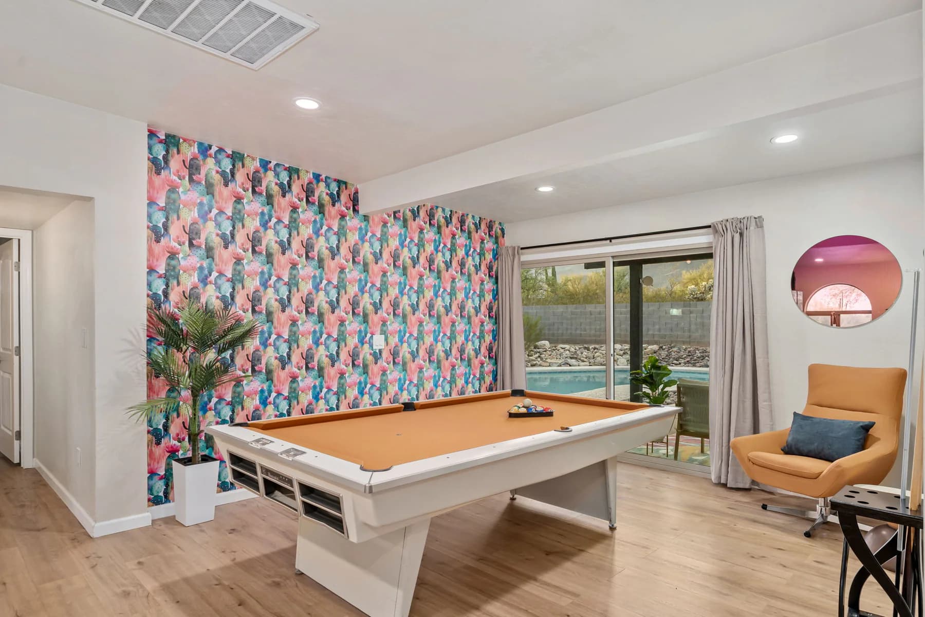 Airbnb game room and pool amenity photographed by Luxe Realty Photography